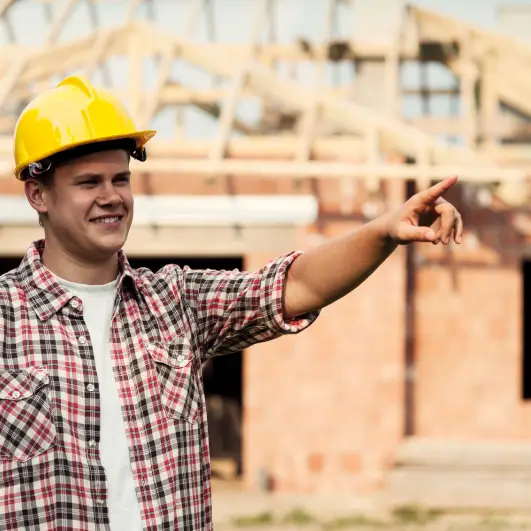 Construction worker pointing at something